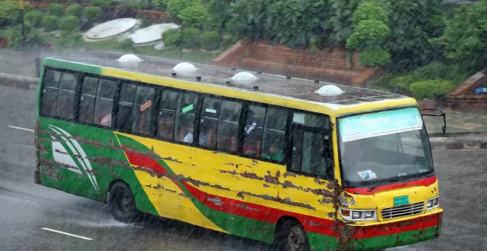 A local bus ferrying people in Dhaka, Bangladesh during the rains