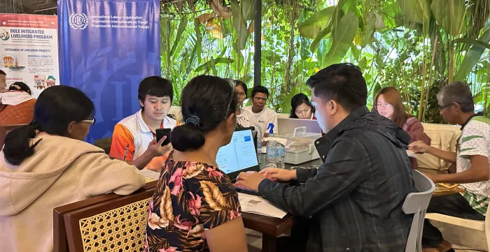 workers at a social protection online and one-stop registration