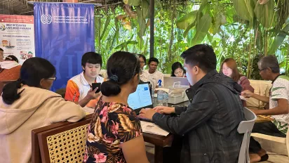 workers at a social protection online and one-stop registration