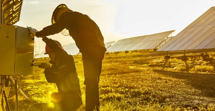 Engineers check solar photovoltaic.