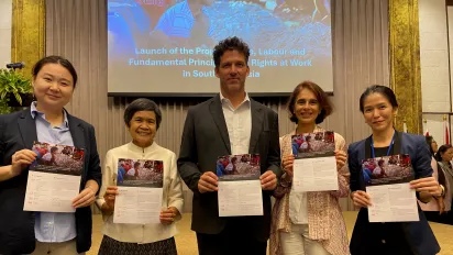 ILO staff led by Deputy Regional Director Panudda Boonpala (2nd left) celebrate the launch in Bangkok.