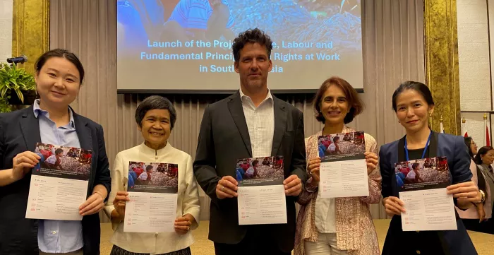 ILO staff led by Deputy Regional Director Panudda Boonpala (2nd left) celebrate the launch in Bangkok.